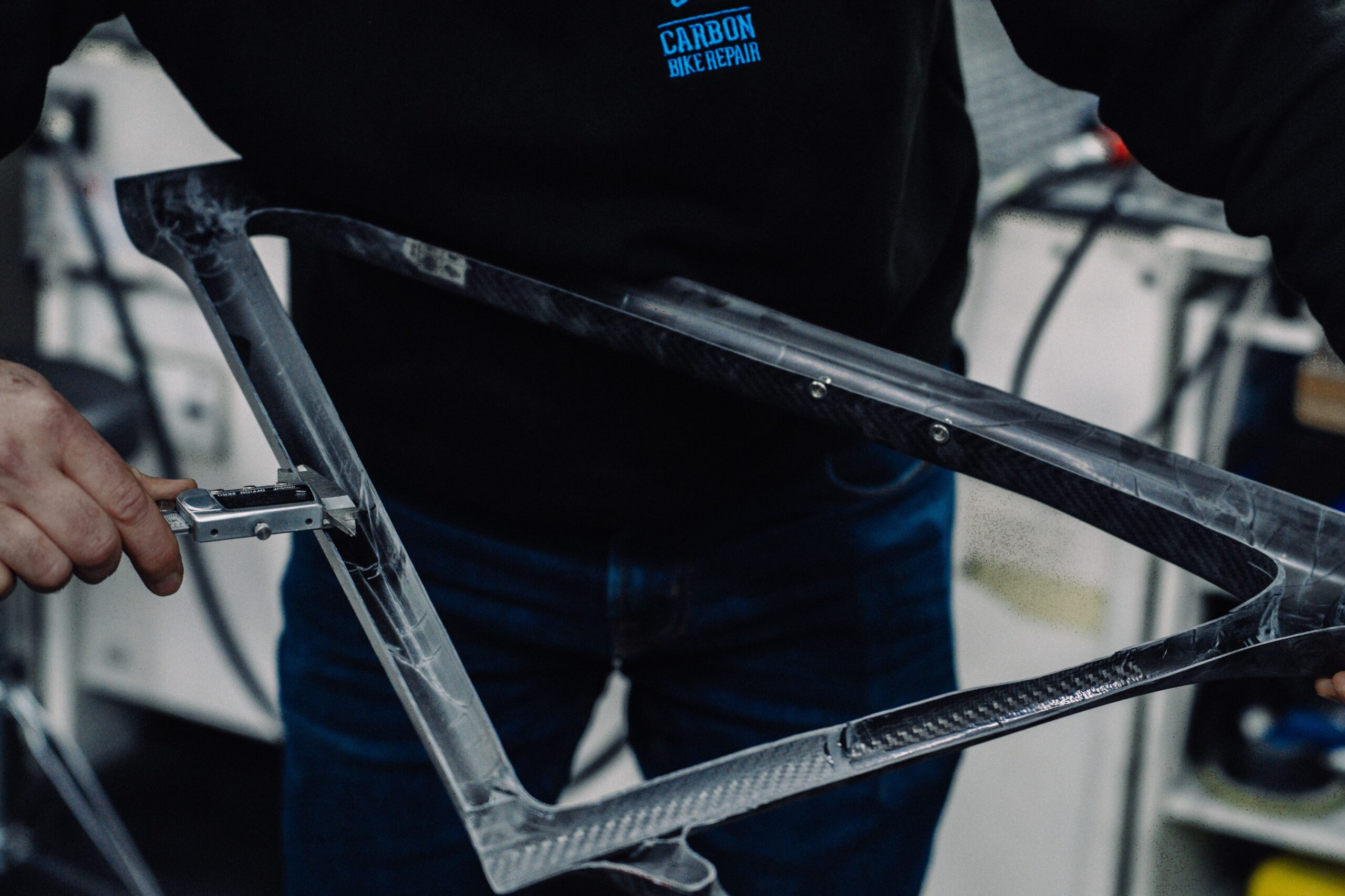 CNC Robot working on carbon fiber bike frame of National Climb Champ Andrew Feather